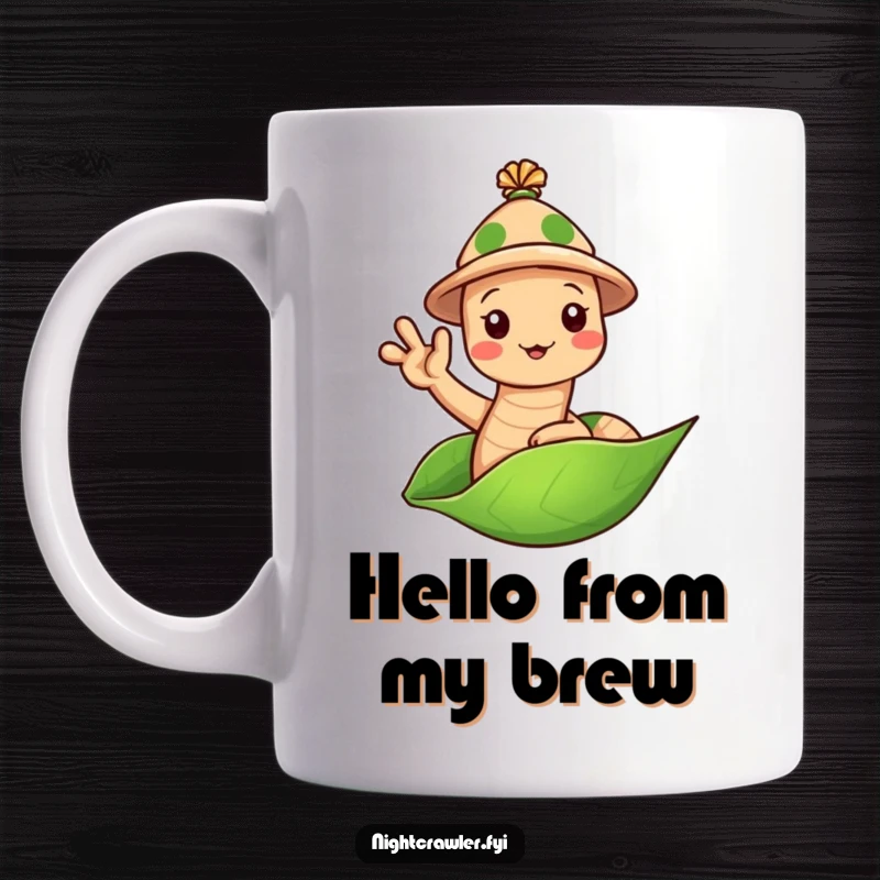 Funny Earthworm Hat Mug: Cute worm in a tiny hat waving hello from a leaf, a friendly and humorous gift.