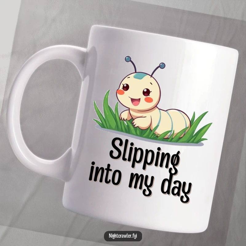 Funny mug featuring a cheerful night crawler character joyfully sliding down a dewy blade of grass.