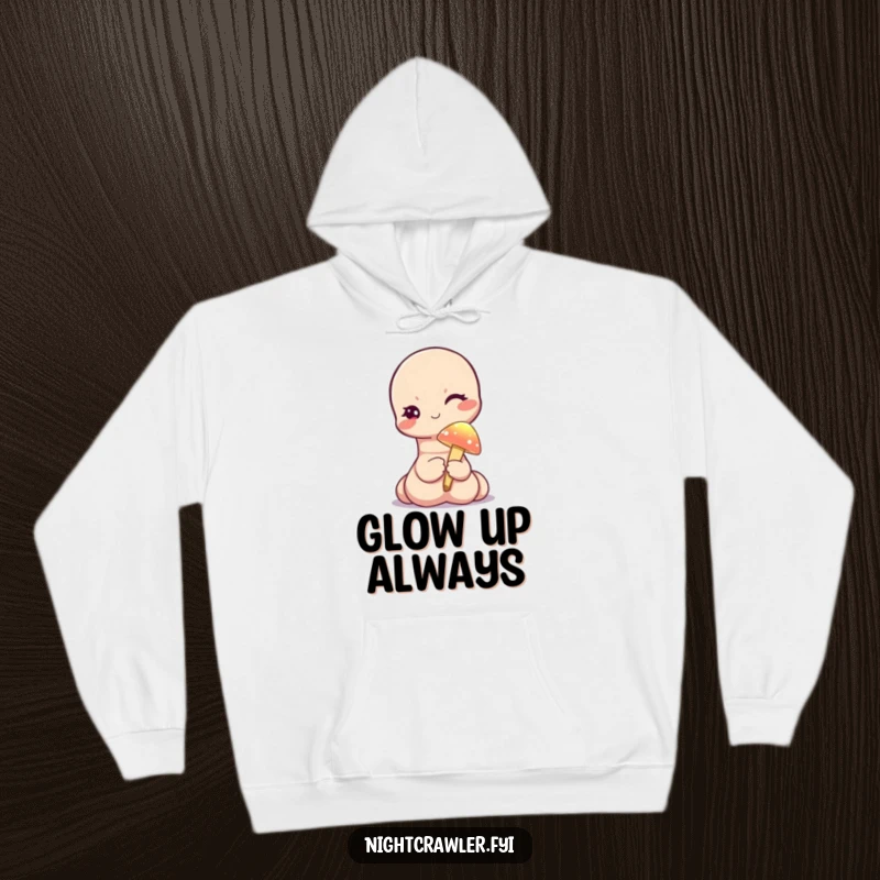 Funny hoodie showcasing a cute worm character winking while holding a tiny, illuminated mushroom, offering warmth and whimsical magic.