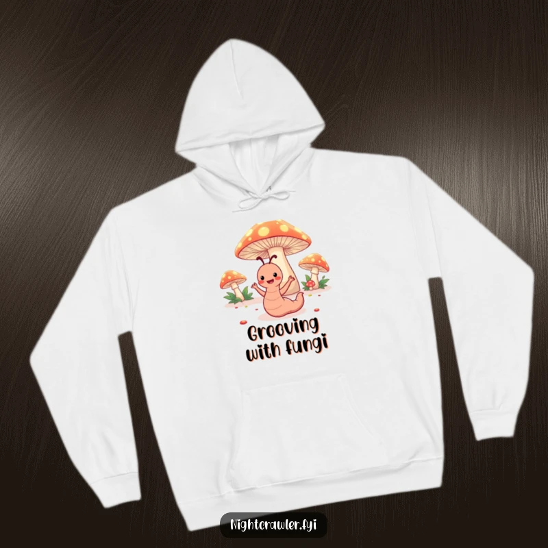 Funny hoodie featuring a happy worm character dancing under glowing toadstools, offering cozy and humorous woodland charm.