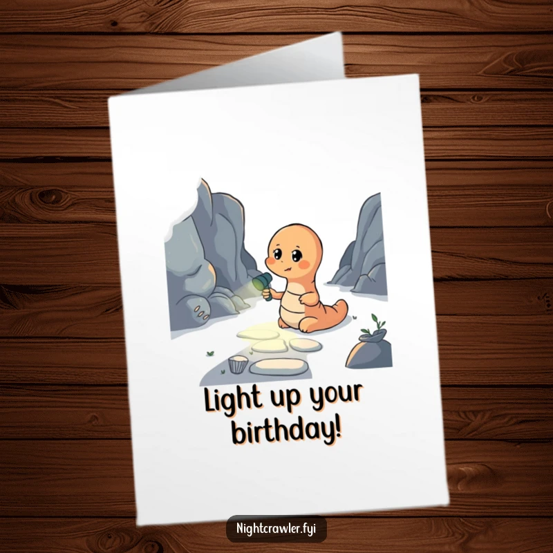 Funny Free Printable Birthday Card: Earthworm holding a flashlight, bravely illuminating a dark path forward with optimism.