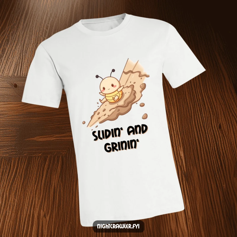 Funny t-shirt with a cute buggy character gleefully sliding down a muddy slope, embodying pure, messy, joyful adventure.