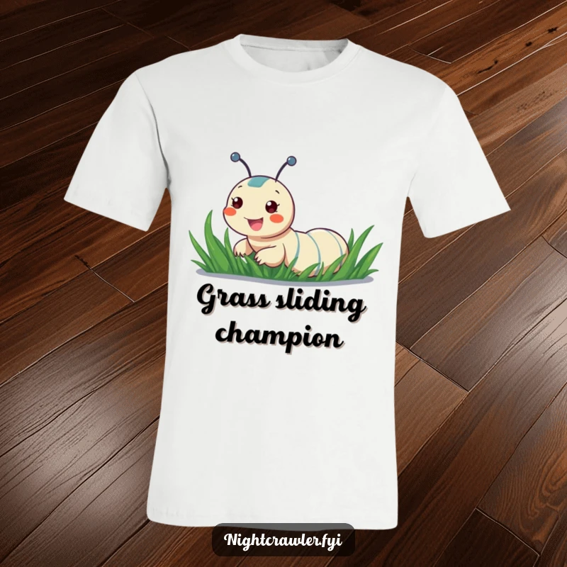 Funny T-shirt depicting a cheerful night crawler sliding with glee down a dewy blade of grass, capturing a moment of fun.