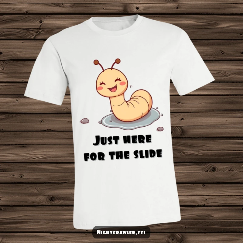 Funny t-shirt featuring a gleeful worm character joyfully sliding down a slick pebble, illustrating a moment of pure, uninhibited fun.