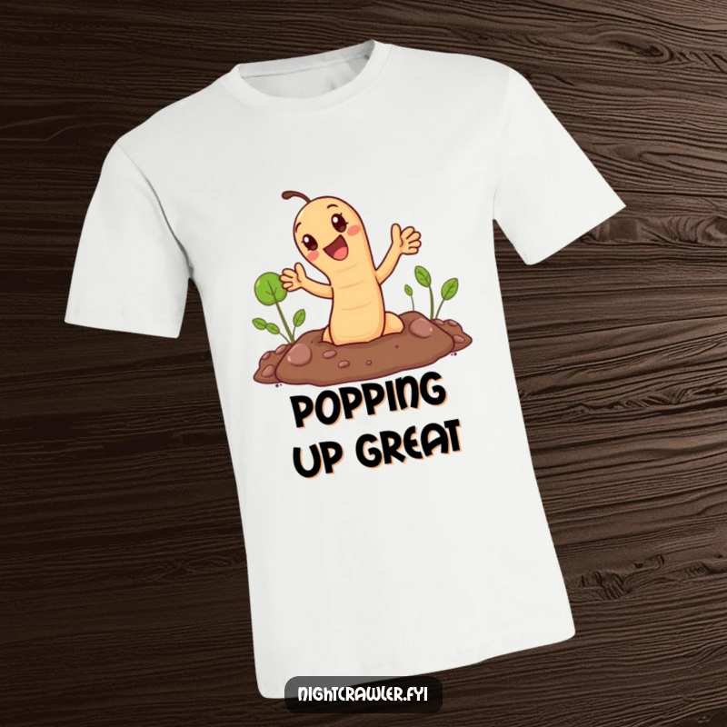 Funny t-shirt: cute earthworm popping out of the ground, waving cheerfully. Fun garden humor.