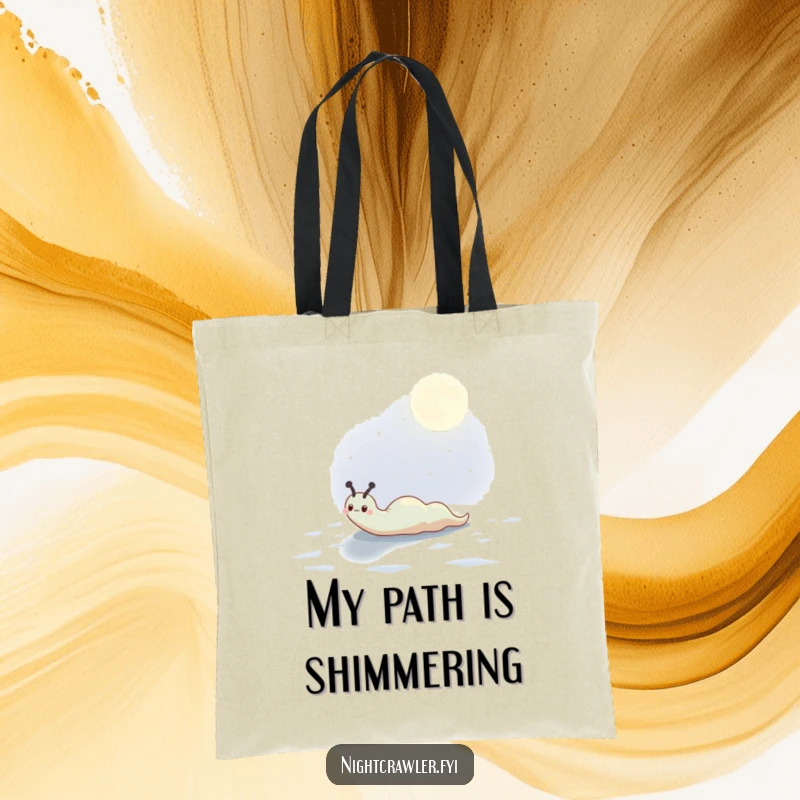 Funny tote bag showcasing a cute slug character leaving a shimmering trail across a moonlit surface, symbolizing gentle progress.